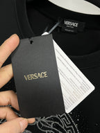 Versace black sweatshirt with brand neck label and care tag