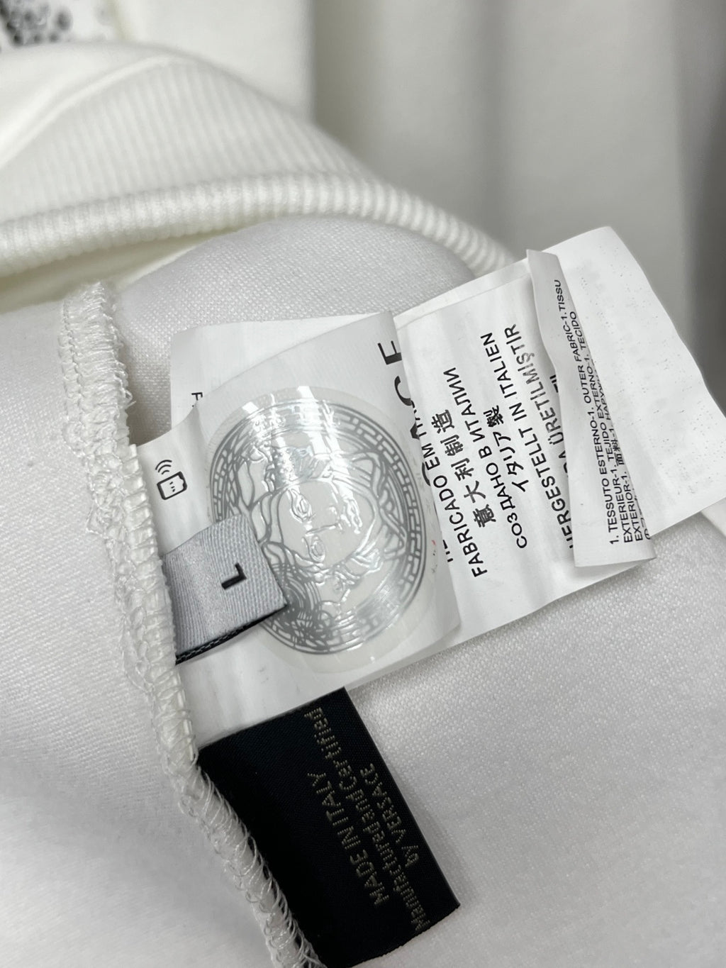 White sweatshirt neck label and ribbed collar trim