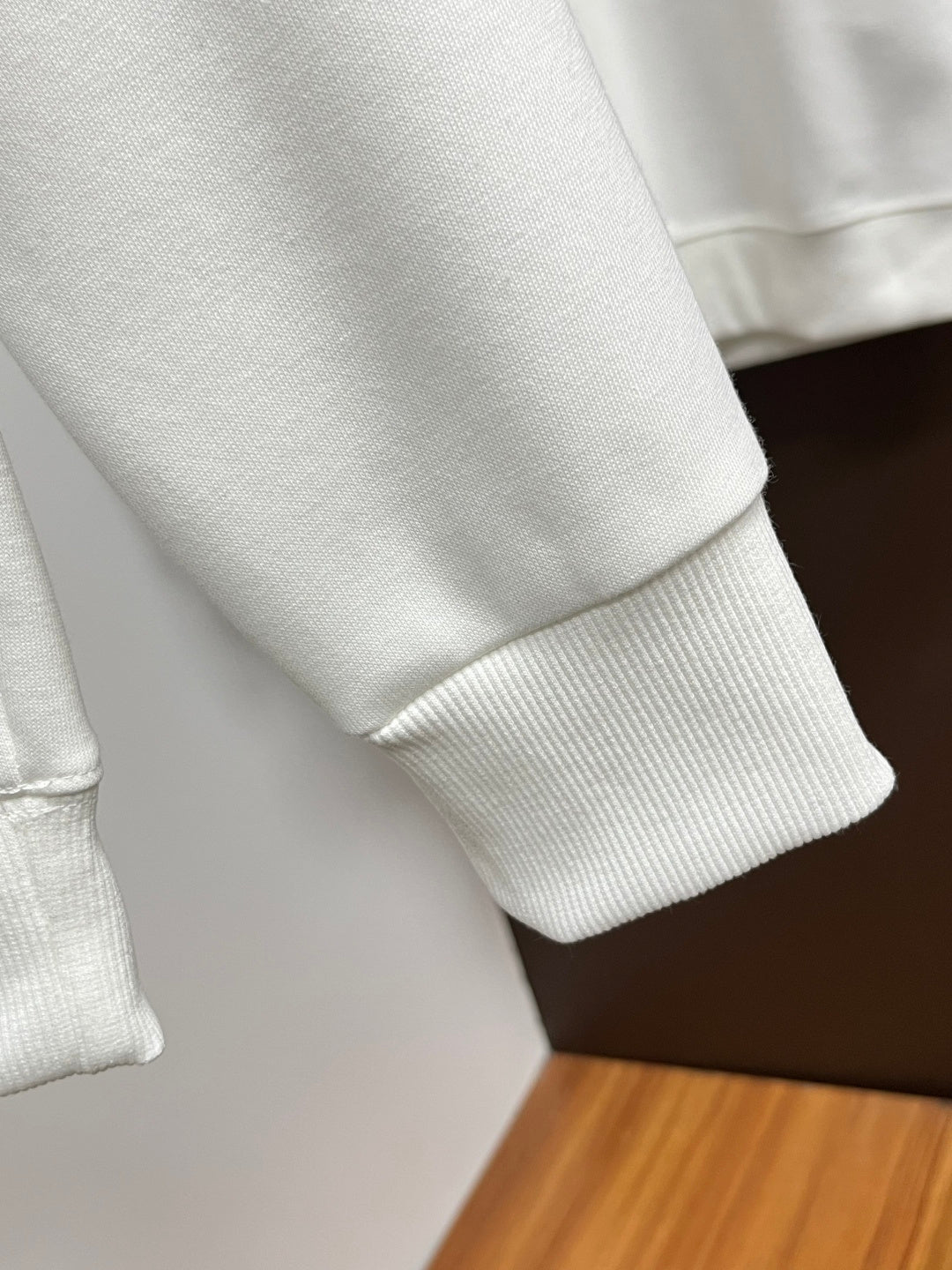 White sweatshirt with ribbed sleeve cuff