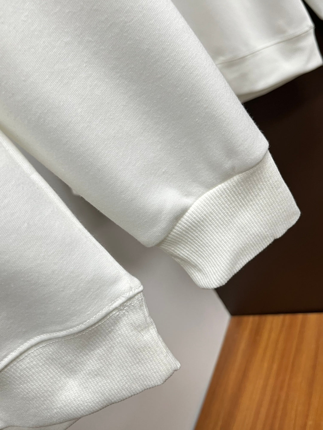 White Versace sweatshirt sleeve and hem with ribbed cuffs
