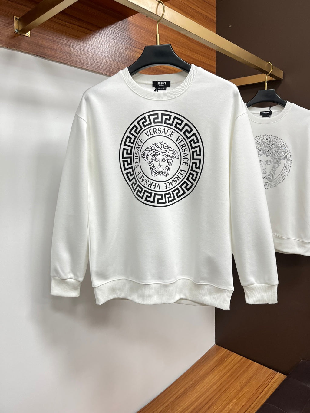 White Versace sweatshirt with large circular Medusa logo on chest