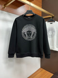 Black crewneck sweatshirt with jeweled face logo print