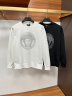White and black crewneck sweatshirts with jeweled face crest print