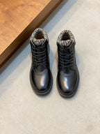 Dark leather lace-up ankle boots with patterned fabric collar and chunky tread sole