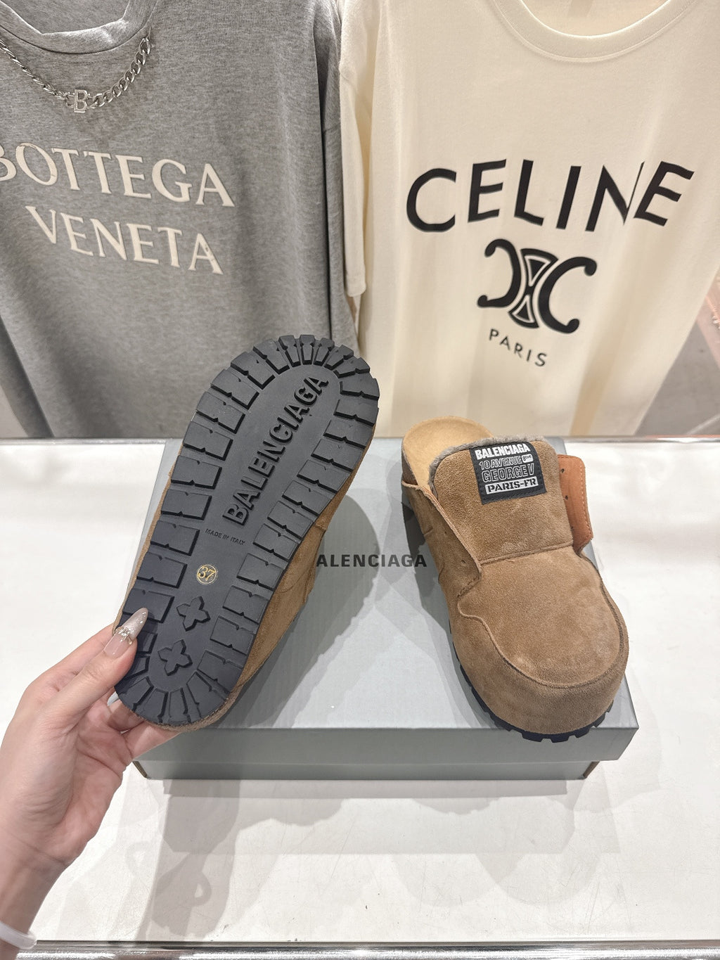 Brown suede sandals with shearling lining and visible tread sole