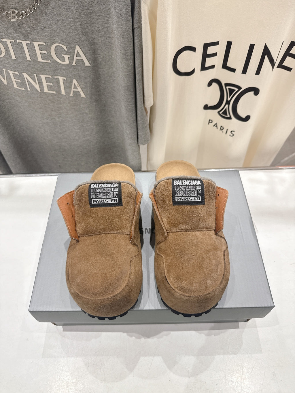 Brown suede slip-on sandals with shearling lining and Balenciaga label on top