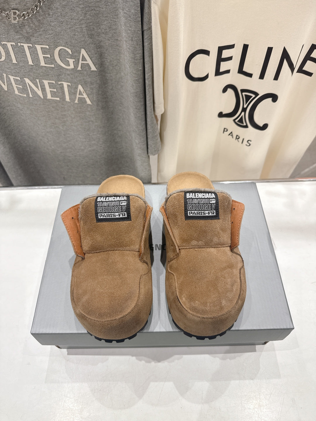 Brown suede slip-on sandals with shearling lining and Balenciaga label on top