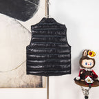 Black quilted sleeveless puffer vest with high collar and horizontal stripes