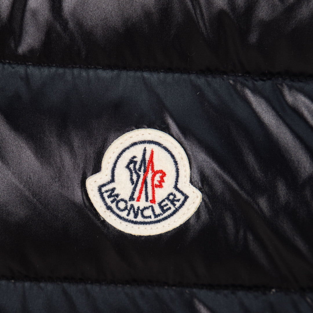 Moncler logo patch on black quilted puffer vest