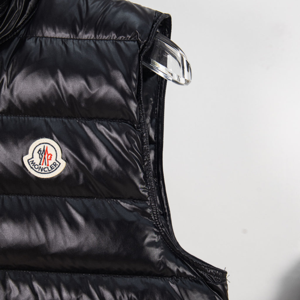 Moncler black puffer vest shoulder with logo patch and metal zipper pull