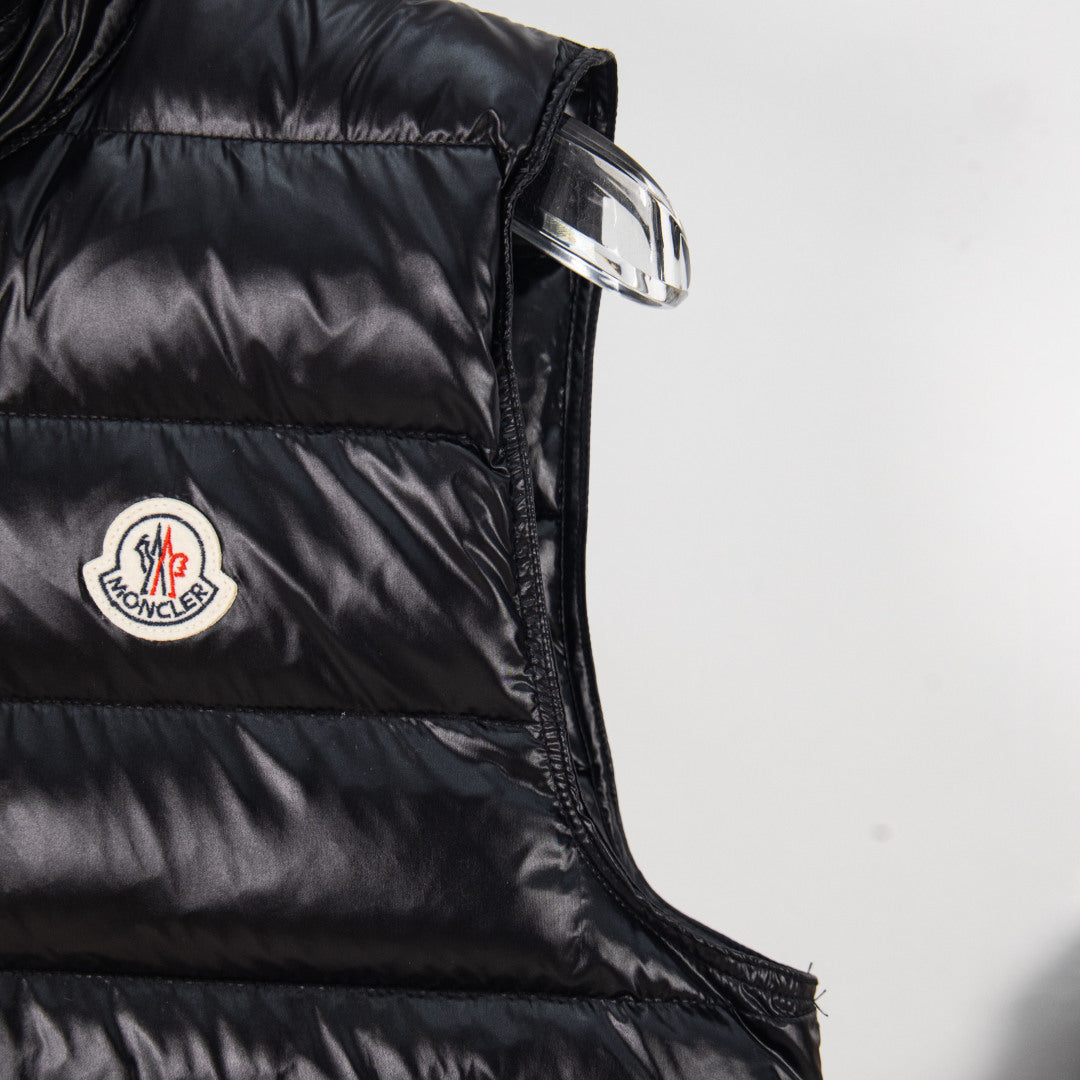 Moncler black puffer vest shoulder with logo patch and metal zipper pull