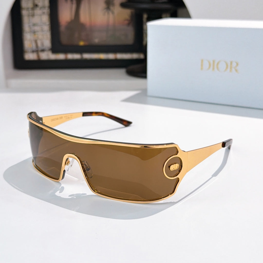 Dior sunglasses with brown tinted lenses and gold-trim frame