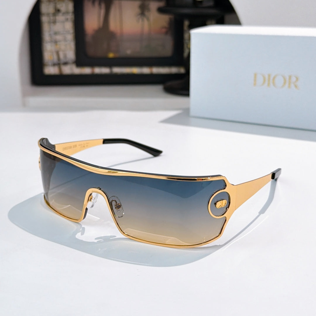 Dior sunglasses with blue tinted lenses and gold-trim frame