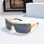 Dior sunglasses with dark blue tinted lenses and gold-trim frame