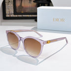 Sunglasses with light purple frames and tan gradient lenses, gold logo detail on temple