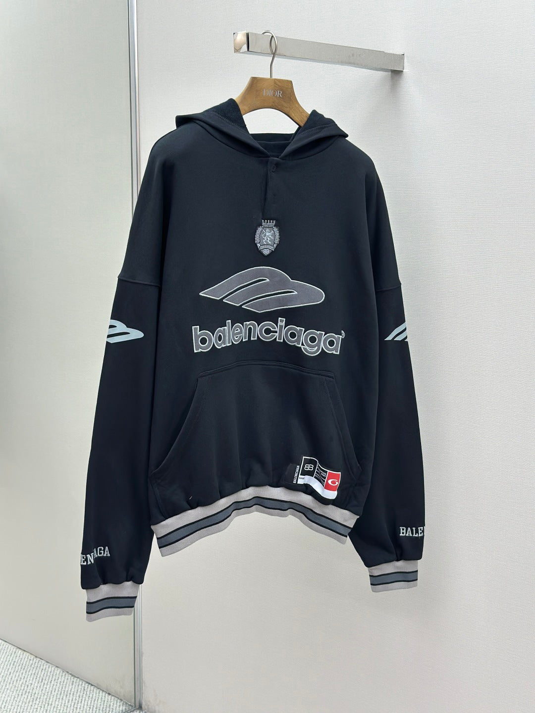 Balenciaga navy pullover hoodie with front logo and hood, ribbed hem