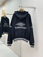 Balenciaga navy pullover hoodie, back print and hood up on hanger