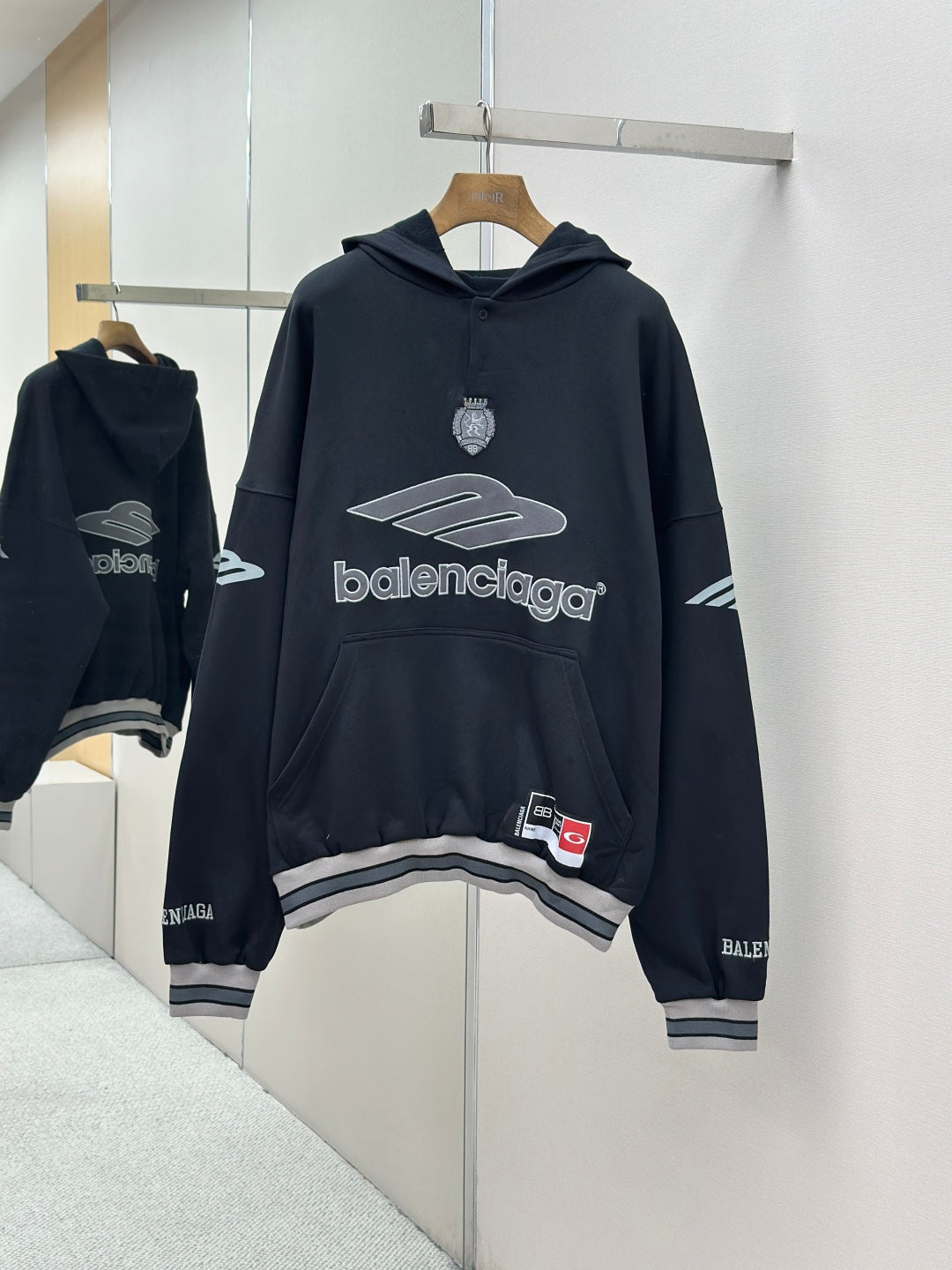 Balenciaga navy pullover hoodie with large front logo graphic and hood