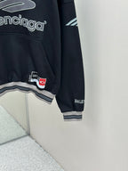 Balenciaga navy pullover hoodie sleeve with logo patch and ribbed cuff