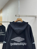 Balenciaga navy pullover hoodie back view with large logo graphic on hanger