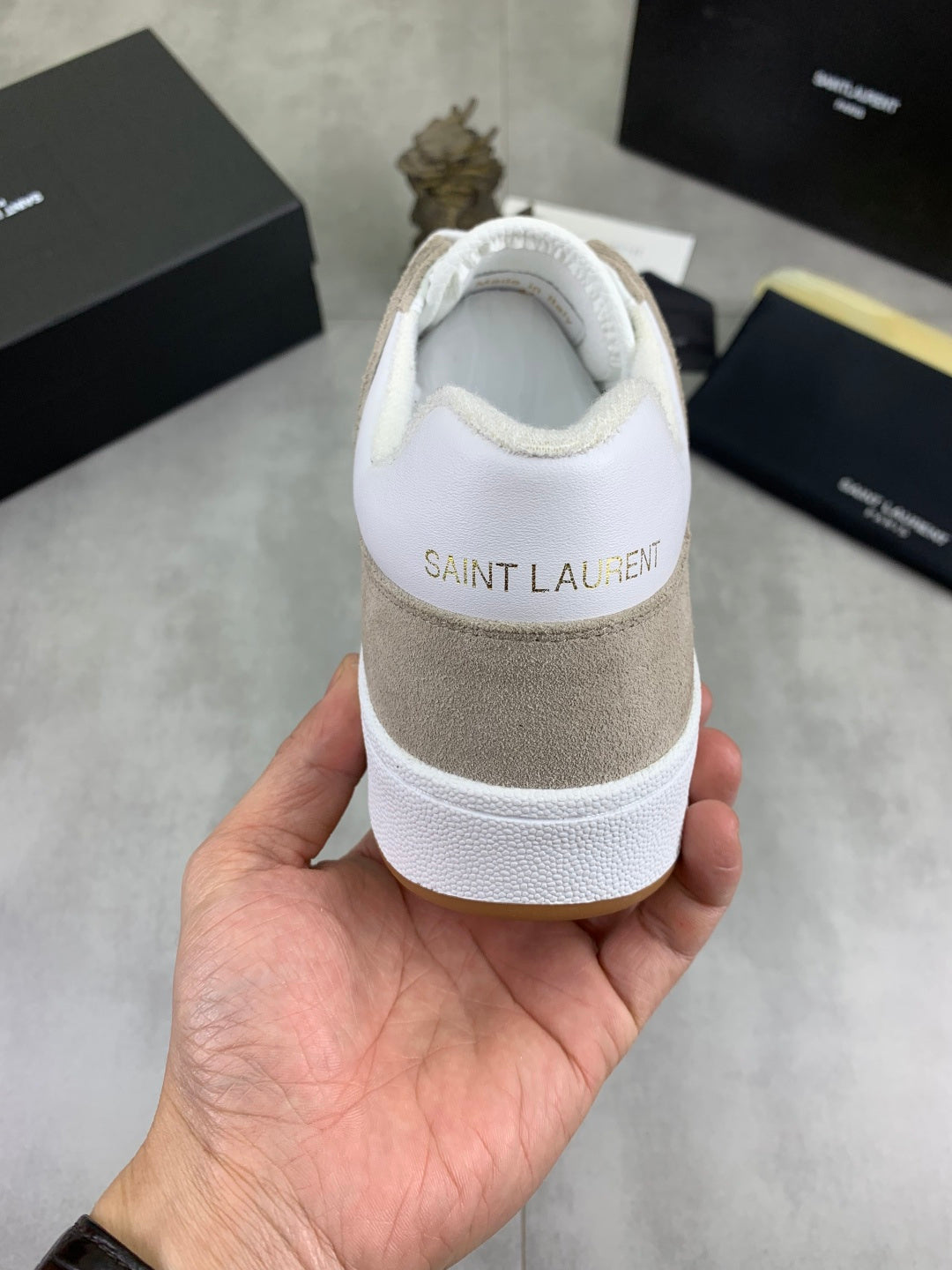 Back view low-top sneakers, white heel and toe with beige suede back and white sole