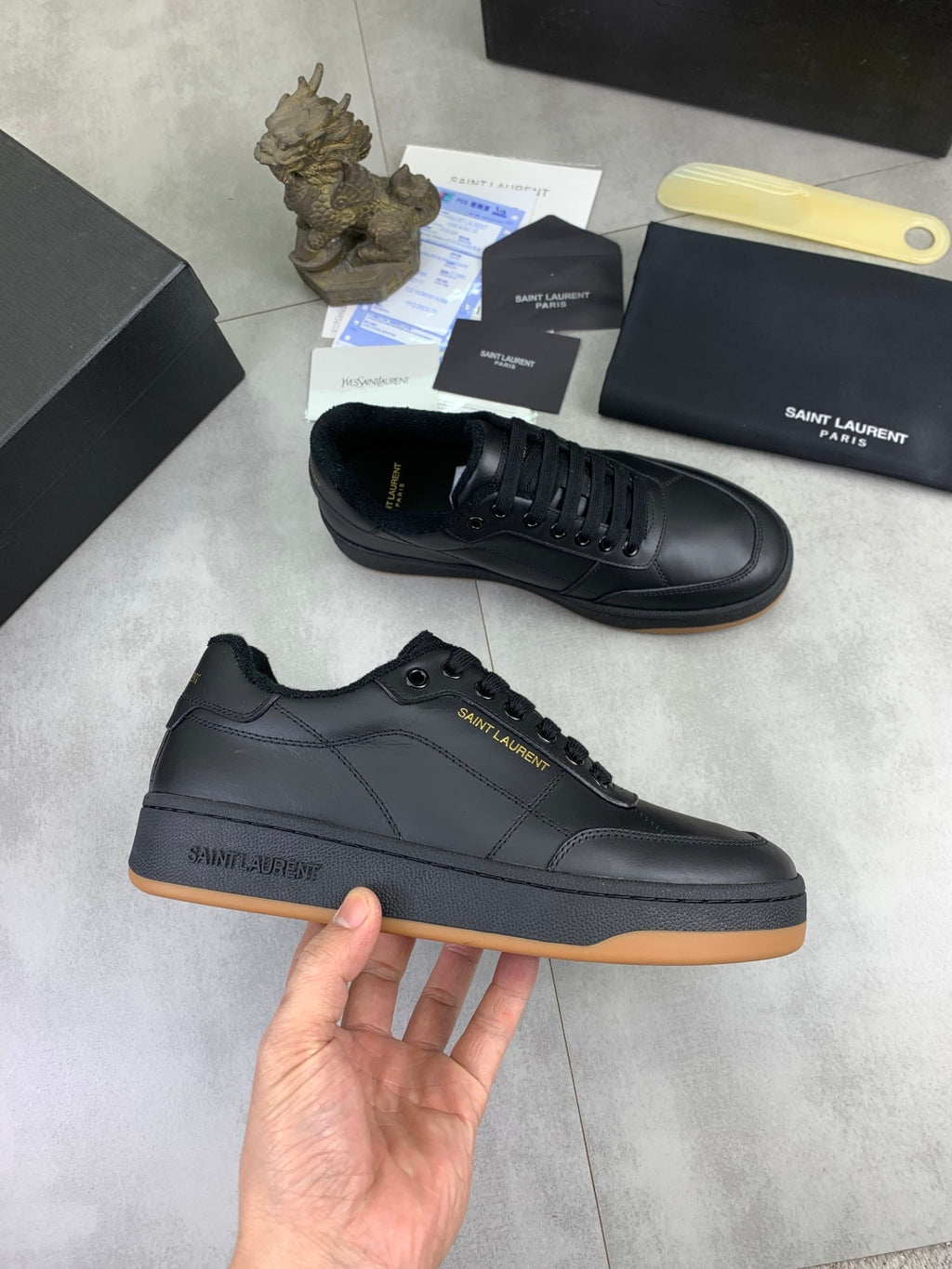 Unisex dark navy lace-up sneakers with gum-tone rubber sole and side logo
