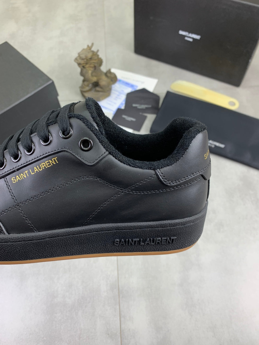 Unisex dark navy lace-up sneaker upper with stitched overlays and logo at side