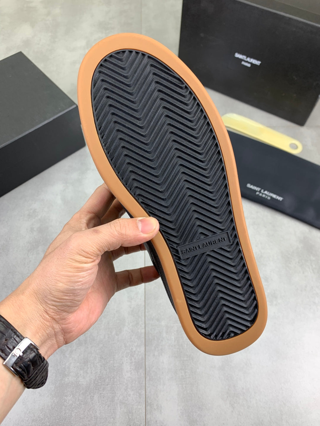 Unisex dark navy sneaker outsole with ribbed tread and tan rubber border