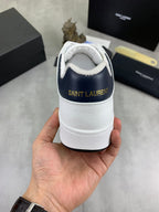 White leather sneakers with SAINT LAURENT logo on heel and navy collar lining