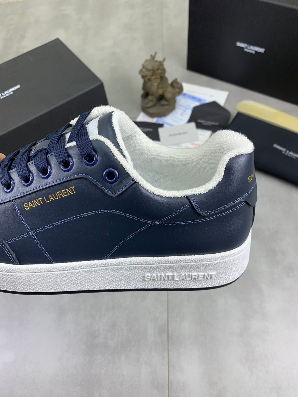 Navy leather sneakers with white contrast collar and SAINT LAURENT logo on side