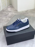Navy low-top sneakers with white rubber sole and lace-up closure, SAINT LAURENT