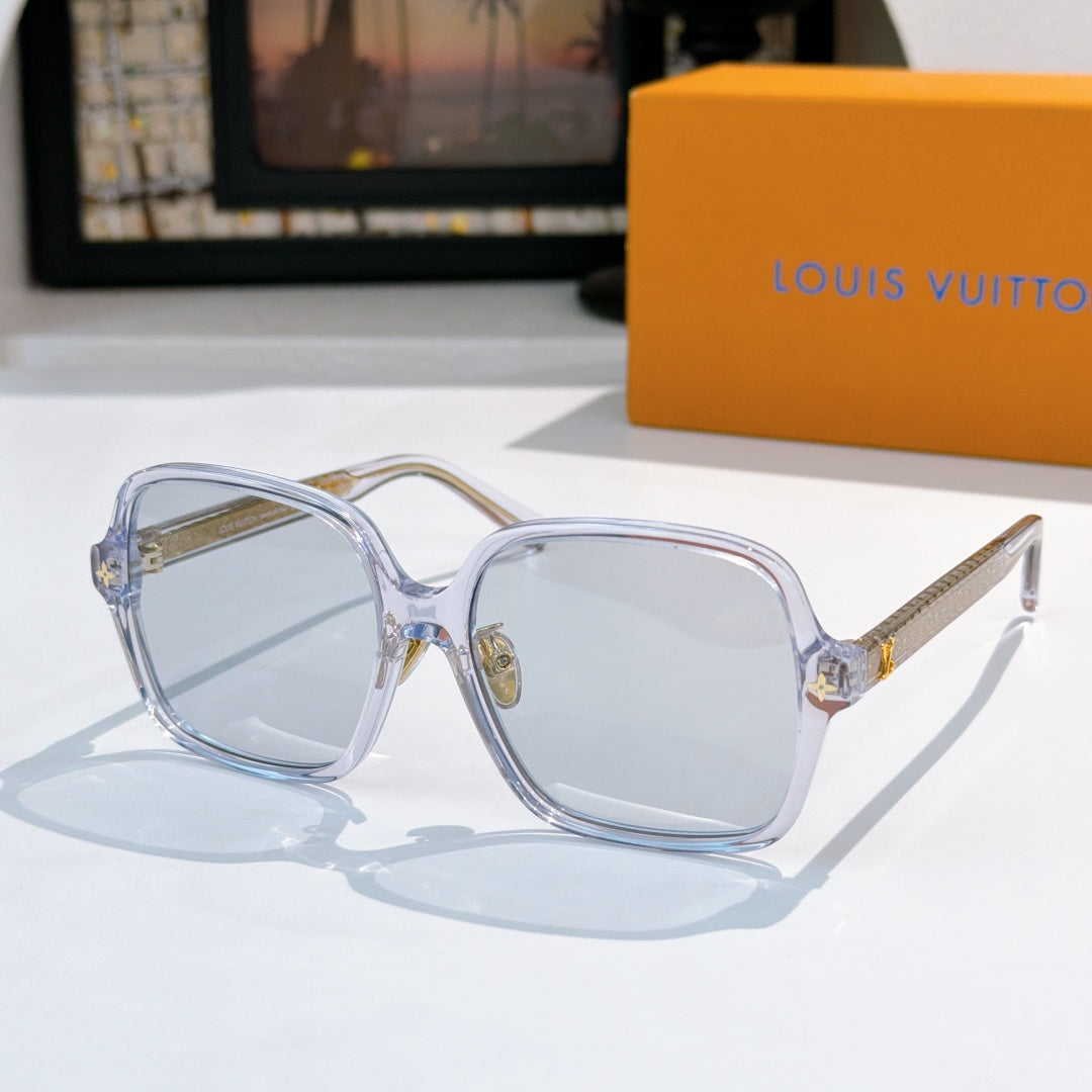 Louis Vuitton sunglasses, translucent blue frame with pale blue lenses and gold tips