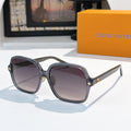 Louis Vuitton sunglasses, dark frame with purple gradient lenses and star accents