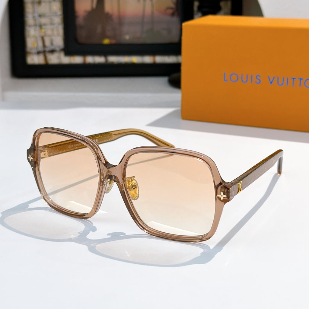 Louis Vuitton sunglasses, translucent brown frame with amber gradient lenses and gold star