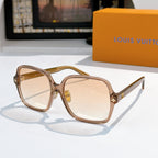 Louis Vuitton sunglasses, translucent brown frame with amber gradient lenses and gold star