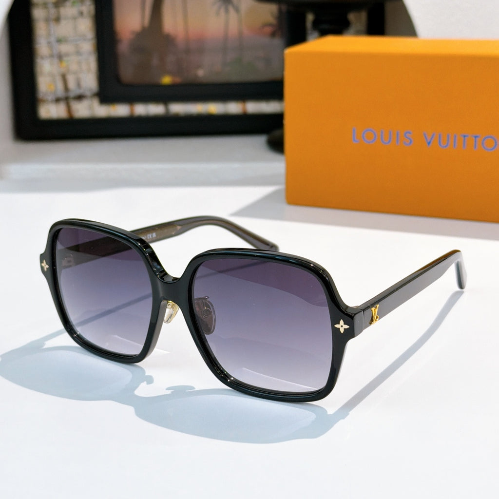 Louis Vuitton sunglasses, dark frame with purple lenses and gold-tone star detail