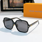 Louis Vuitton sunglasses, dark frame with dark gray lenses and gold star detail