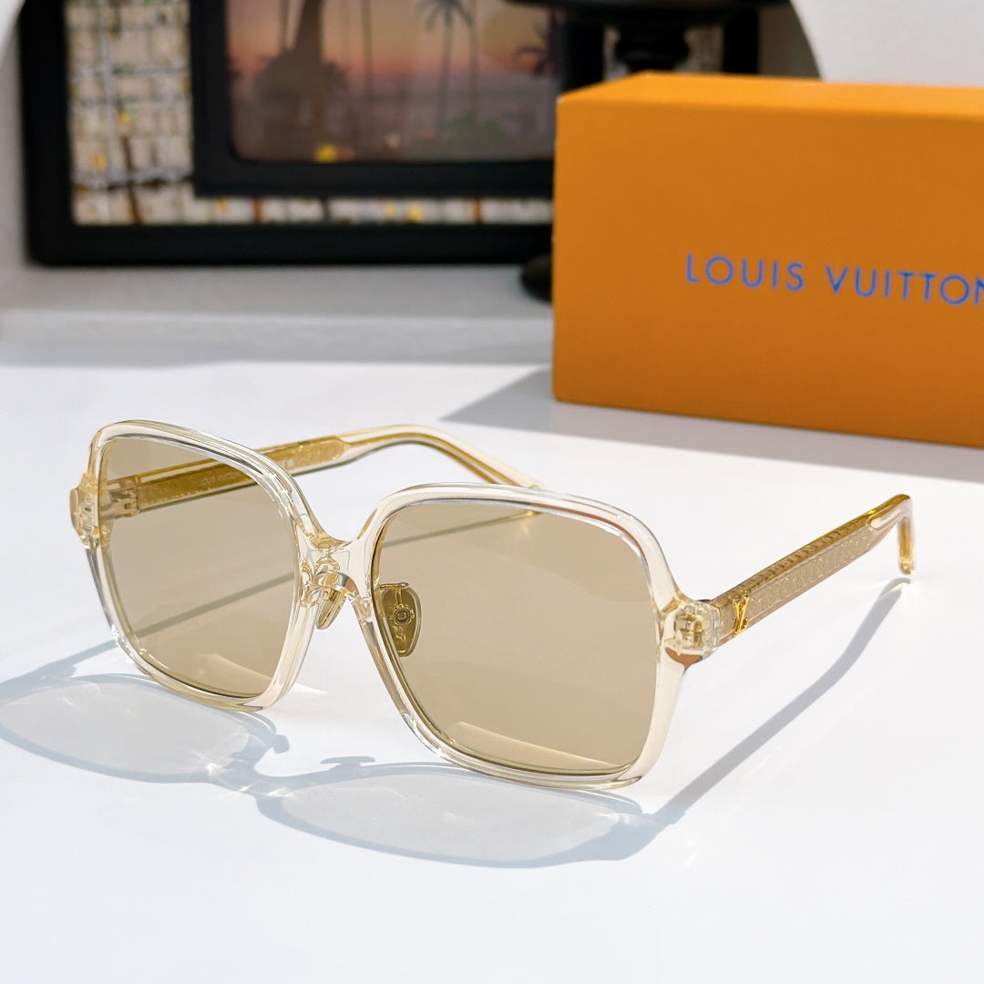 Louis Vuitton sunglasses, clear gold frame with light tan gradient lenses and gold tips