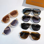 Louis Vuitton sunglasses laid out: black, tan, and tortoiseshell frames
