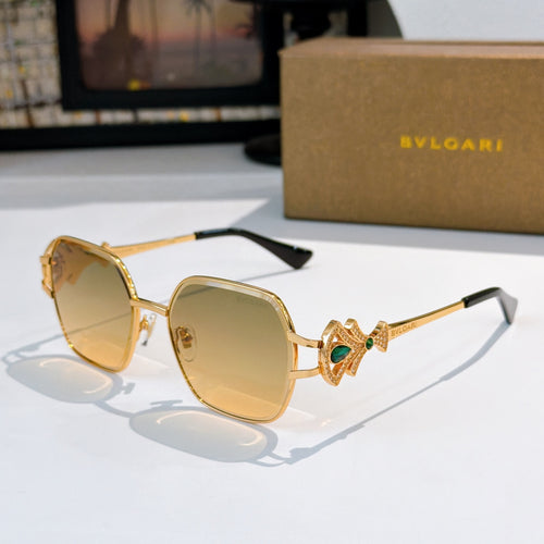 Bvlgari sunglasses with gold frame, tinted amber lenses, jeweled temple detail