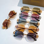 Bvlgari sunglasses set with gold frames and tinted lenses, ornate temple charms