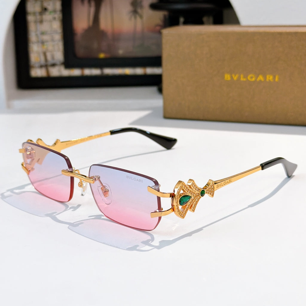 Bvlgari gold-tone sunglasses with pink lenses and green gem jeweled temple detail