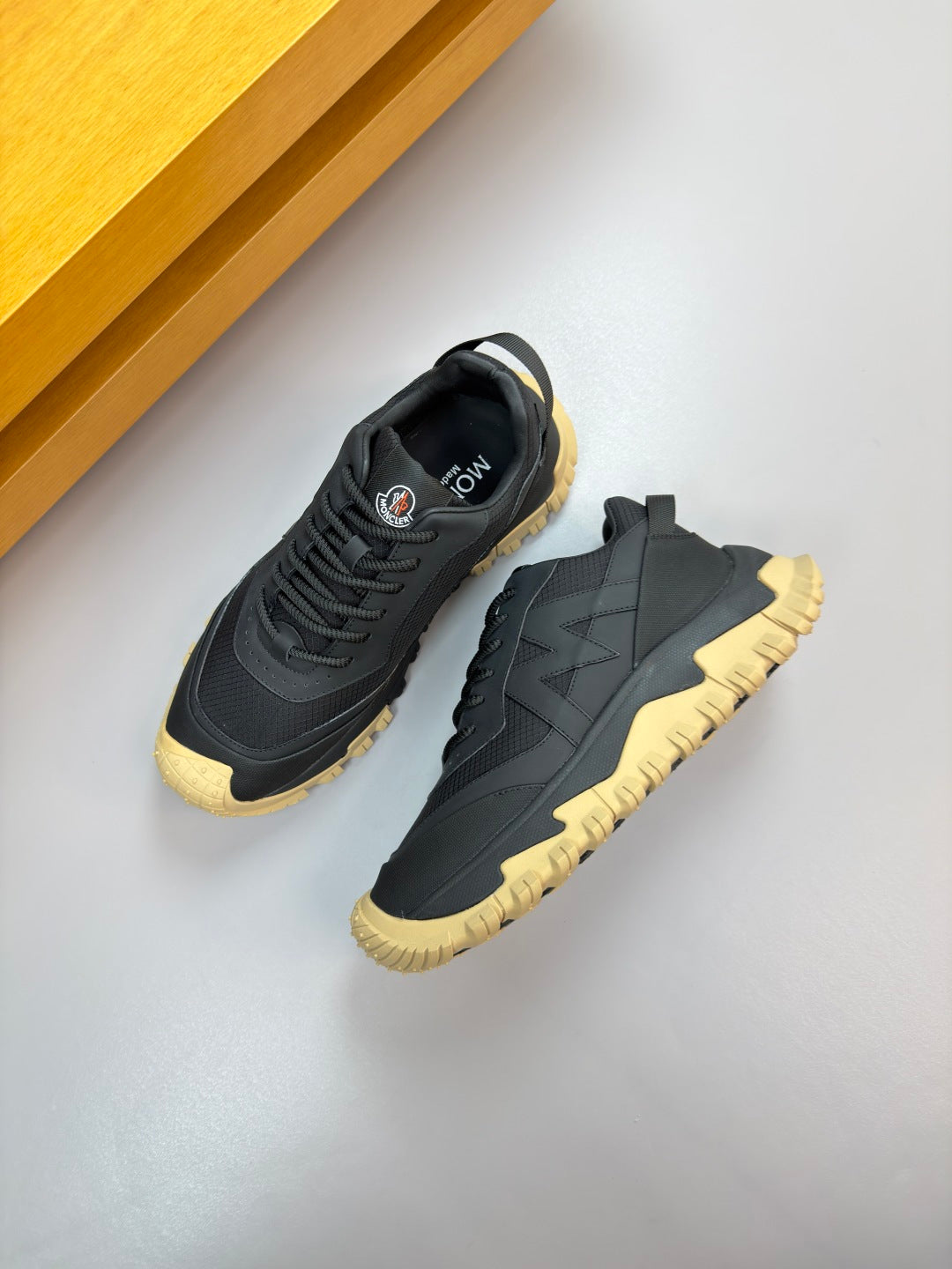 Moncler lace-up sneakers, dark navy with side panel design and gum yellow outsole