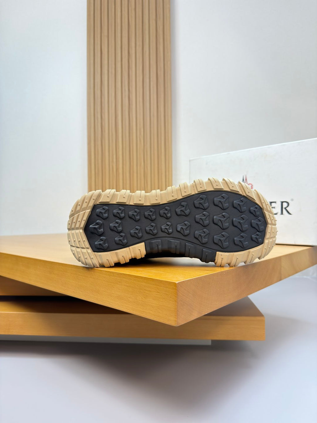 Moncler sneakers outsole view, textured tread with gum yellow rubber base