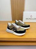 Sneakers with olive, black, and cream panels, white laces, low-profile sole.