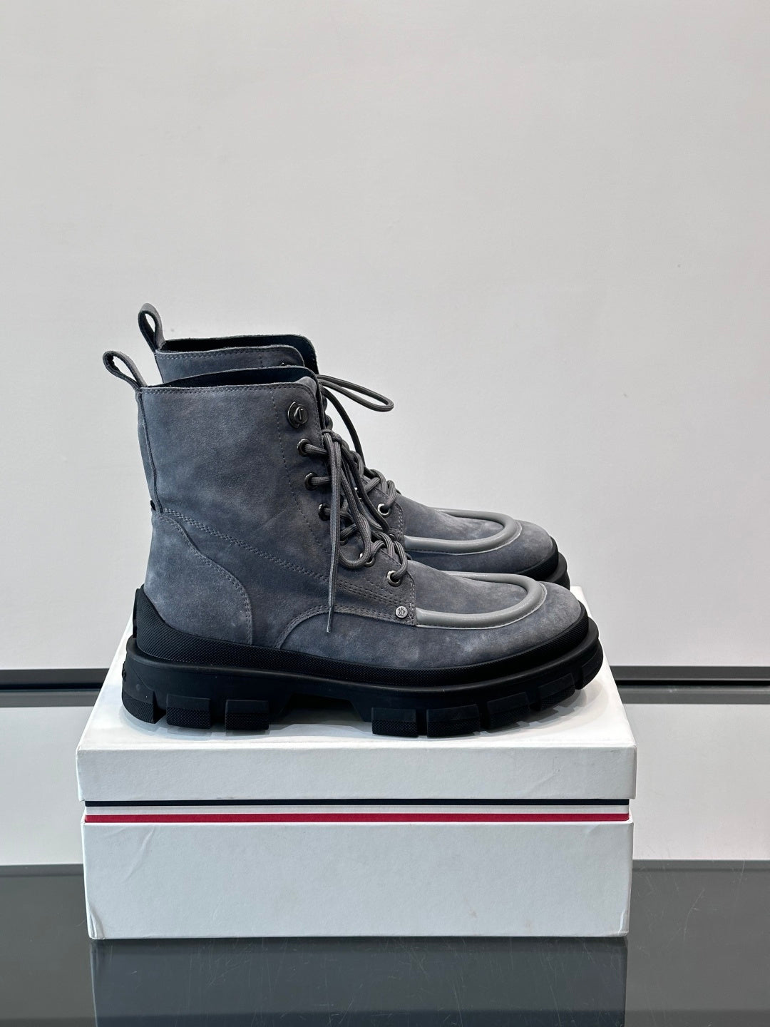 Moncler lace-up ankle boots in dark blue suede with padded collar and lug sole