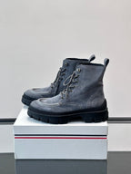 Moncler lace-up ankle boots with dark blue suede finish, eyelets, and treaded outsole