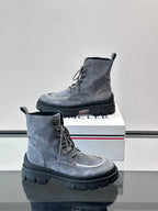 Moncler lace-up ankle boots, two views on box; dark blue suede and thick tread sole