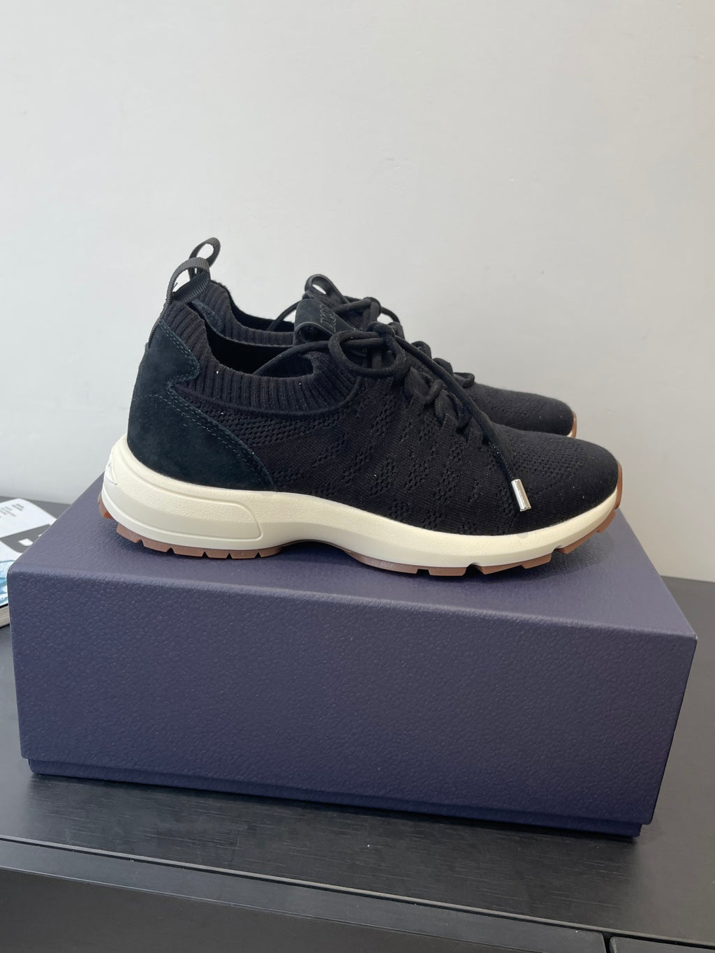 Dark knit lace-up sneakers with thick white sole and low-profile design