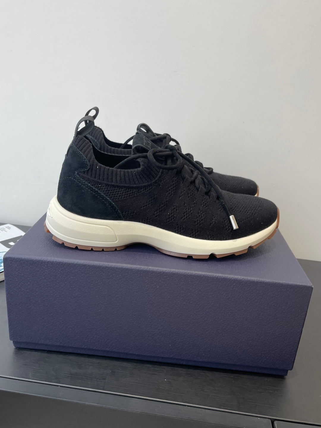 Dark knit lace-up sneakers with thick white sole and low-profile design